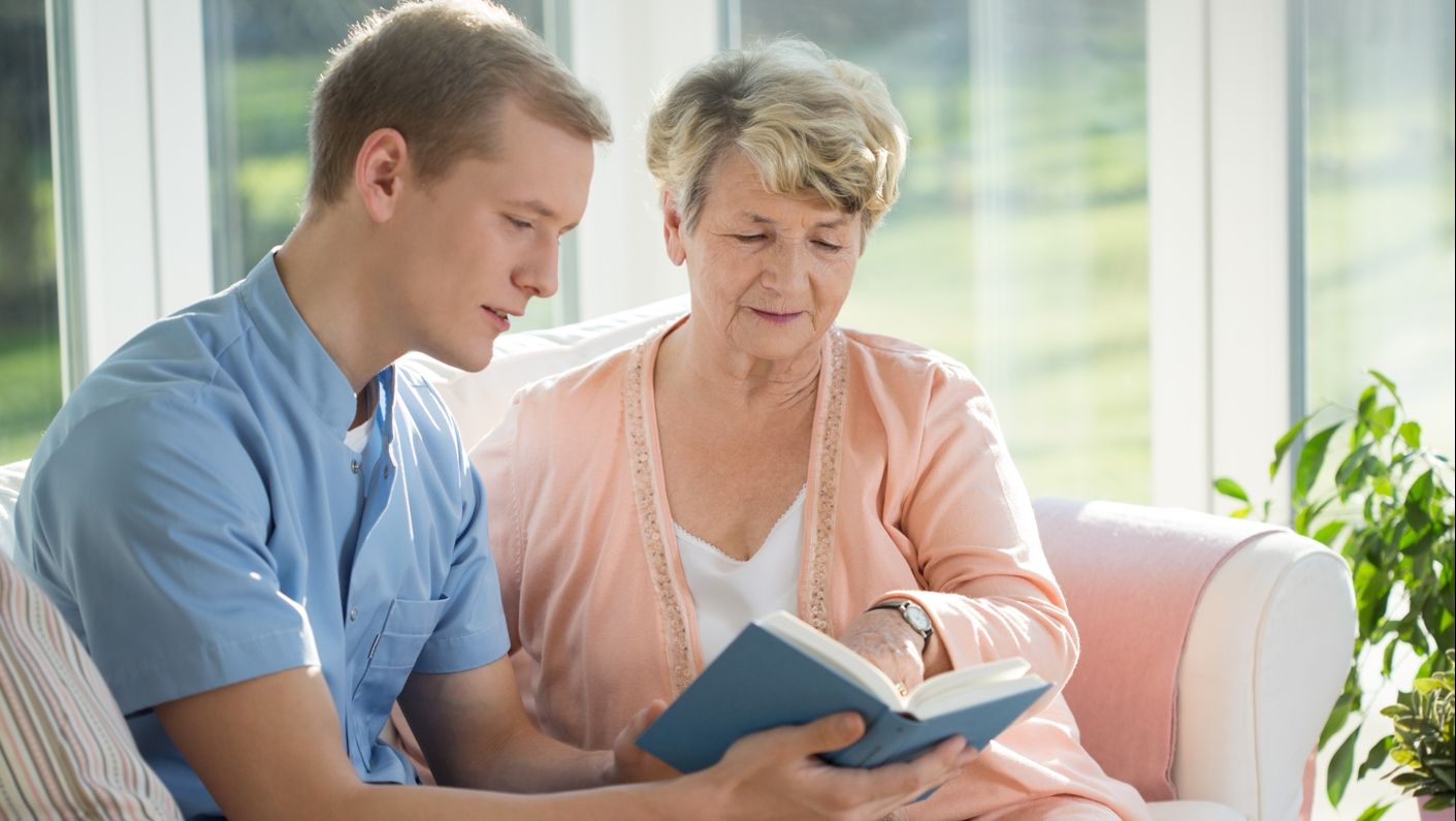 a live-in care expert with an old woman.